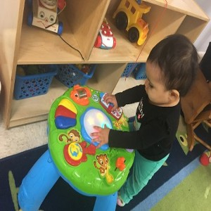 Small Child Playing with a Toy