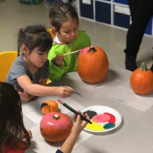 Children Painting Pumpkins